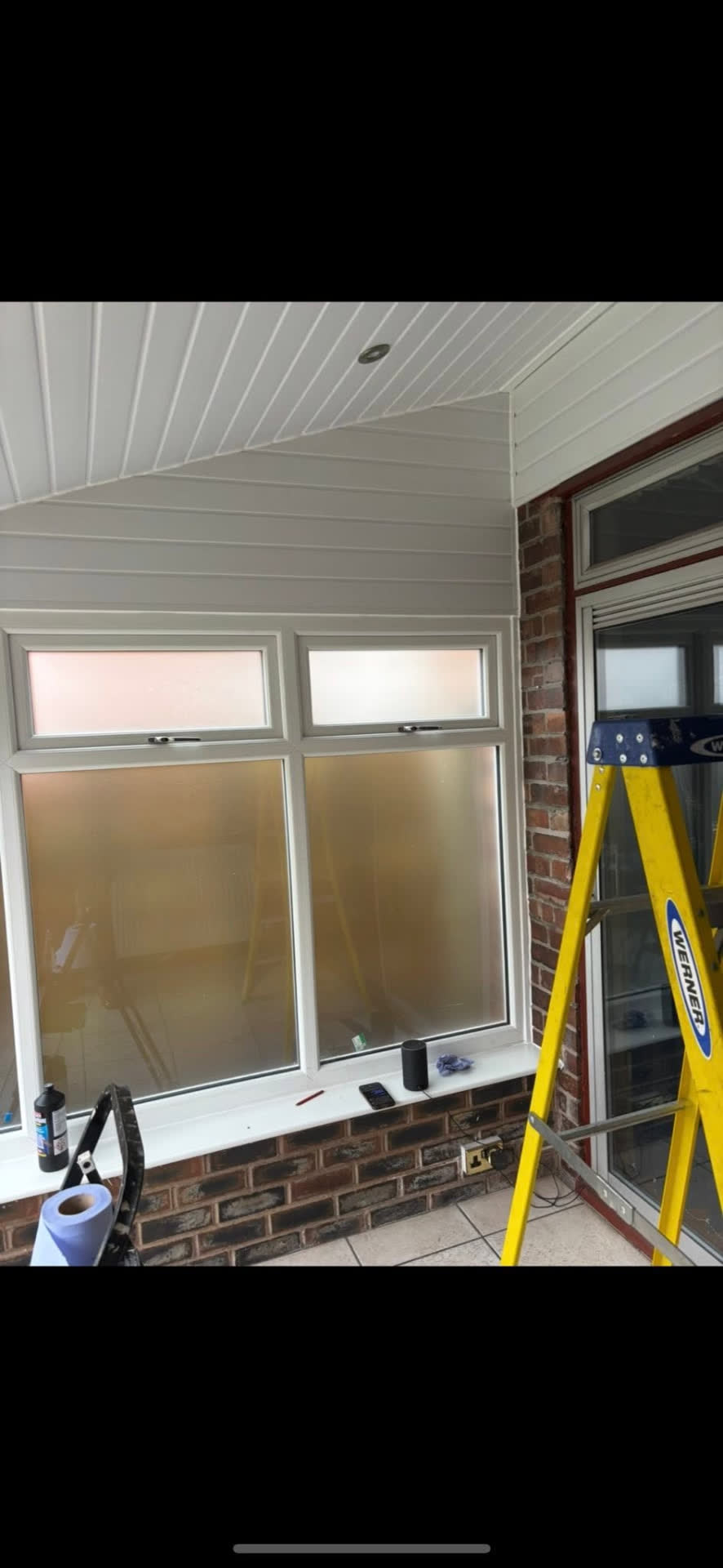 White uPVC shiplap cladding fitted to a porch ceiling and walls by MB Roofline & Joinery in Bury